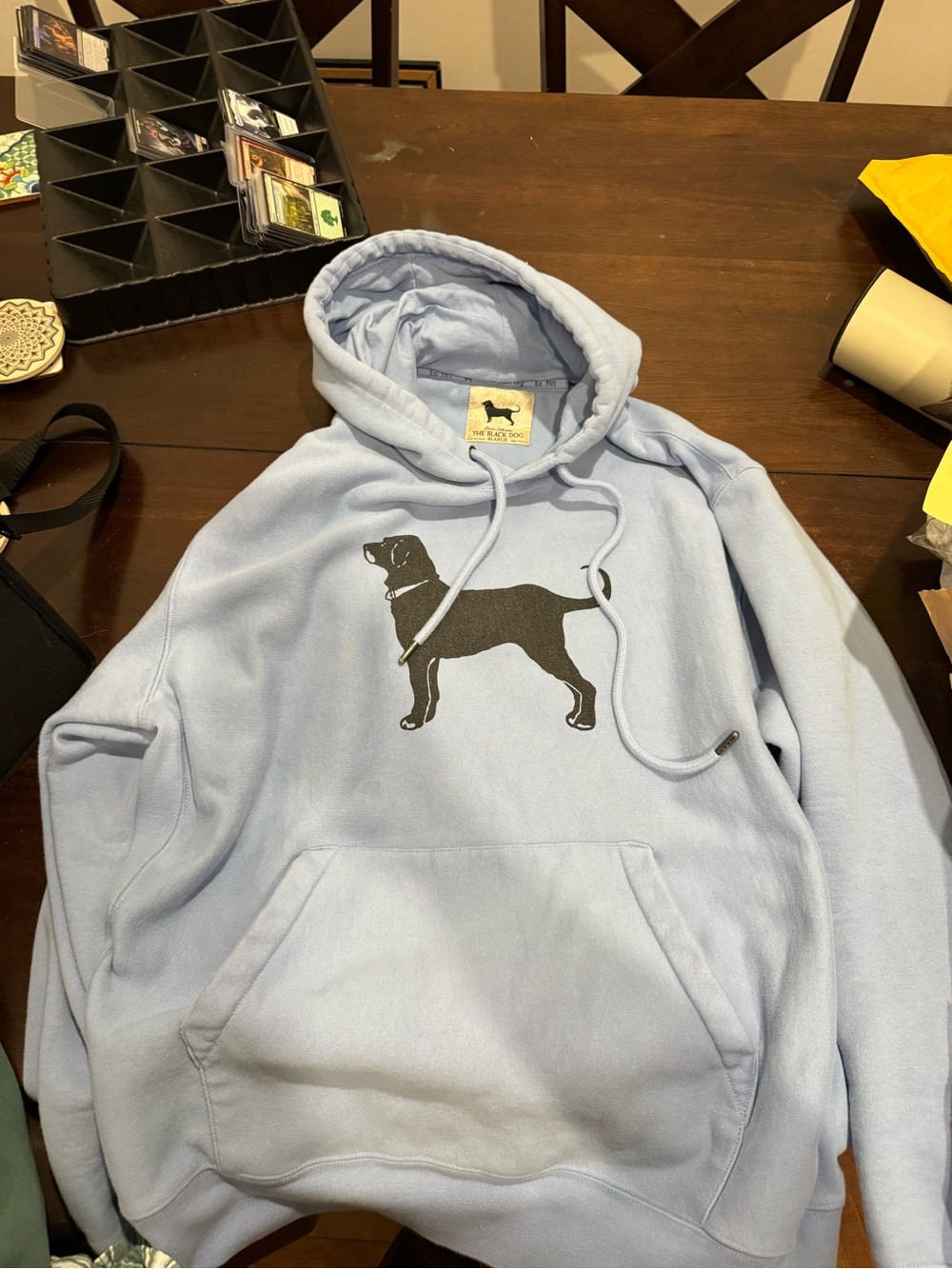 The Black Dog Light Blue Hoodie with Black Dog Silhouette